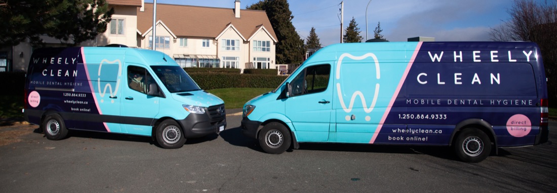 Both Wheely Clean vans parked together on a Victoria residential street